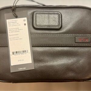 Tumi Black Toiletry Bag with Zipper Closure